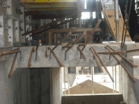 EXPOSED IRON BARS IN A BEAM